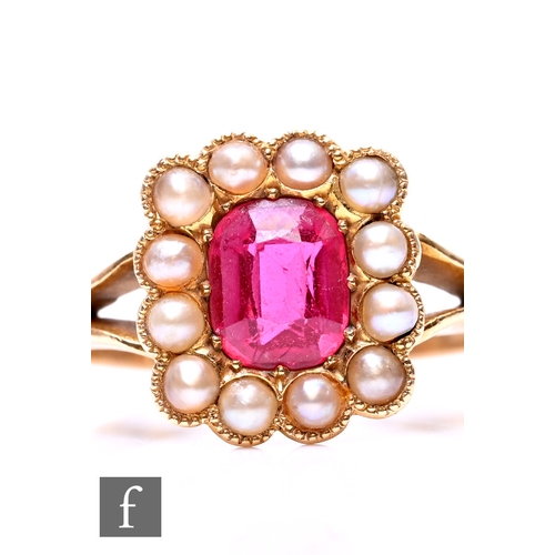 25 - An 18ct gold and synthetic ruby and pearl set dress ring, 3.8g, ring size M.