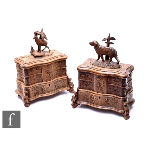 34 - A near pair of late 19th Century Black Forest jewellery boxes, one mounted with a carved figure of a... 