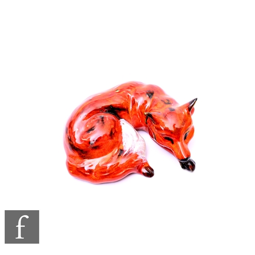 72 - A model of a resting fox by Anita Harris, signed and marked to base 1st trial 20, width 20cm.