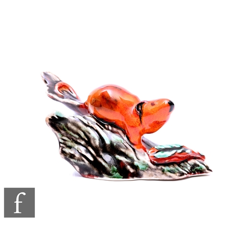 75 - An Anita Harris glazed model of mouse on part of a trunk, signed to base, width 13cm.