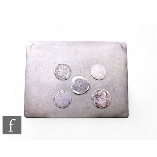 81 - Four hammered silver James I to George II shillings and a 1745 Lima mint shilling contained in a met... 