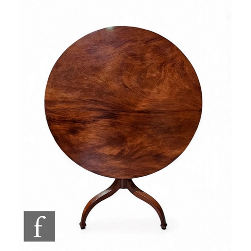 82 - A George III mahogany circular occasional table on turned pedestal and inverted splayed tripod legs,... 