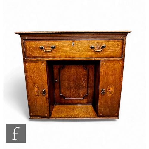 85 - A George III mahogany crossbanded oak kneehole dressing chest fitted with a single long drawer below... 