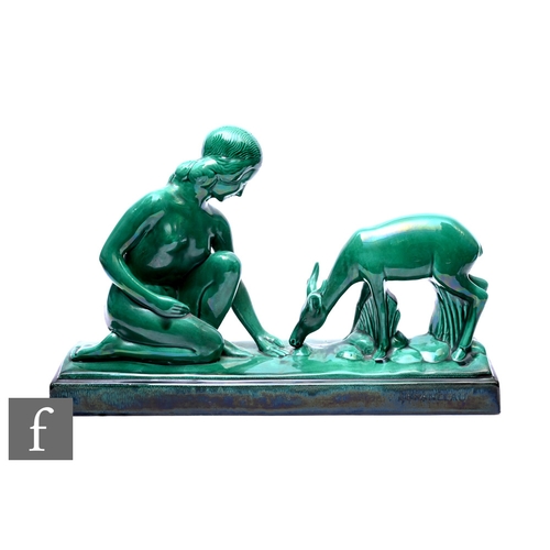 84 - A French ceramic sculpture in the Art Deco style, modelled as young woman and fawn,  in emerald gree... 