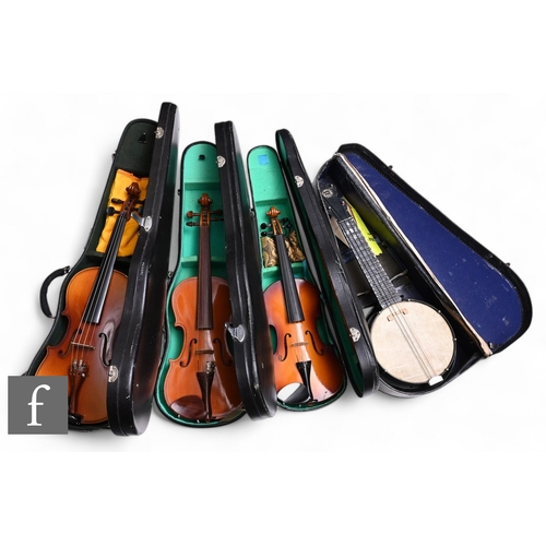 104 - Three 20th Century Chinese violins and cases and a Jolie Joe ukulele, also cased. (4)