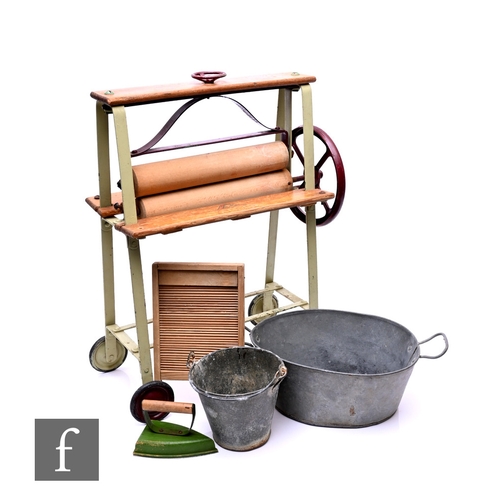 117 - A Triang toy wooden mangle on wheels, with a clothes airer, iron, wash board and two galvanised tubs... 