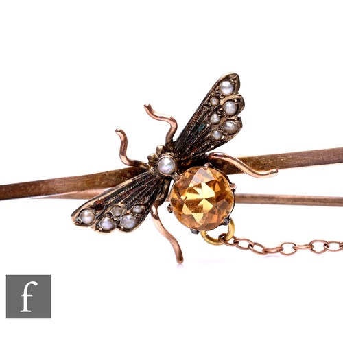 124 - An Edwardian 9ct bar brooch with central study of a fly set with citrine and seed pearls, weight 3.3... 