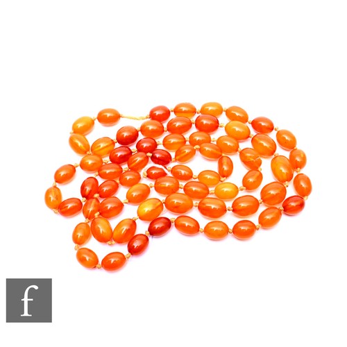 116 - A graduated row of oval butterscotch amber beads, largest length approximately 20mm, total weight 11... 