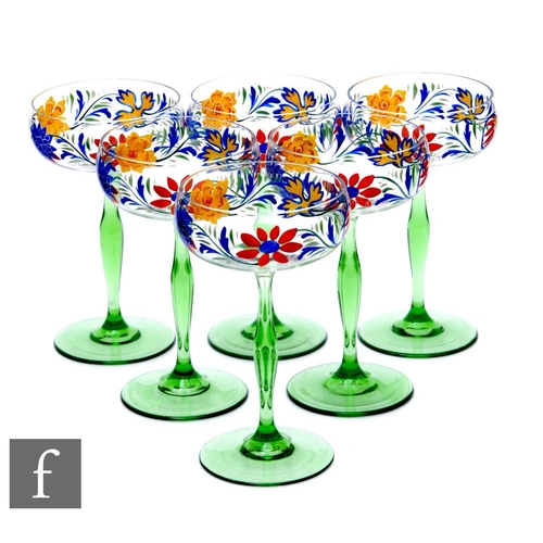 134 - A set of six champagne coupes in the manner of Theresienthal, each bowl enamel decorated with a band... 