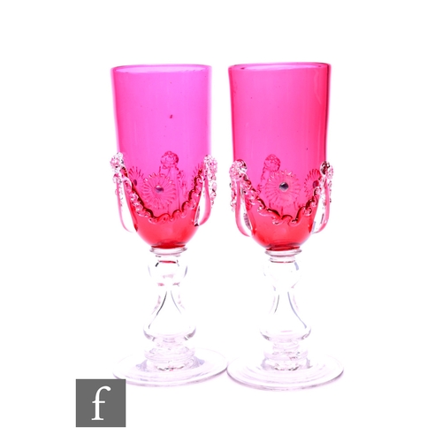 142 - A pair of Victorian glass goblets, the large round funnel bowls decorated with applied clear crystal... 