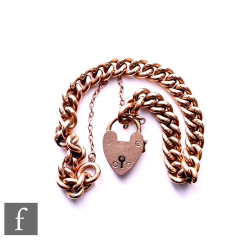 20 - A 9ct rose gold solid link curb bracelet, weight 27g, terminating in padlock fastener.