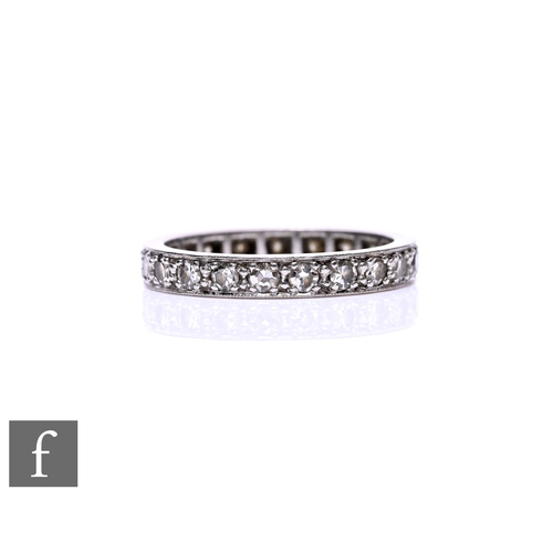 65 - An 18ct white gold diamond full eternity ring, weight 3.4g, ring size L.