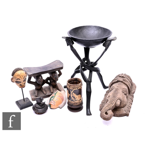 580 - A collection of assorted African and Indonesian items, to include a carved wooden headrest, two smal... 