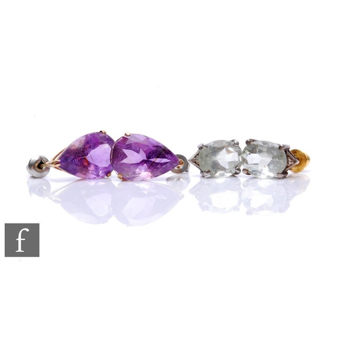 78 - A pair of amethyst stud earrings, pear shaped claw set stones, with a similar pair of aquamarine exa... 