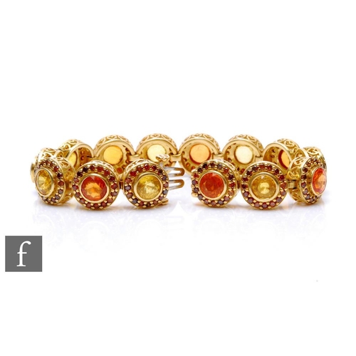 89 - An 18ct sapphire and diamond bracelet comprised of fourteen alternating orange and yellow collar set... 