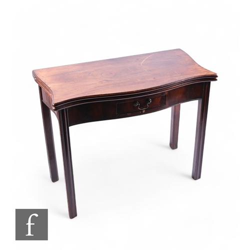 1040 - A George III mahogany serpentine fold over tea table, the moulded edge top over a small drawer, on s... 