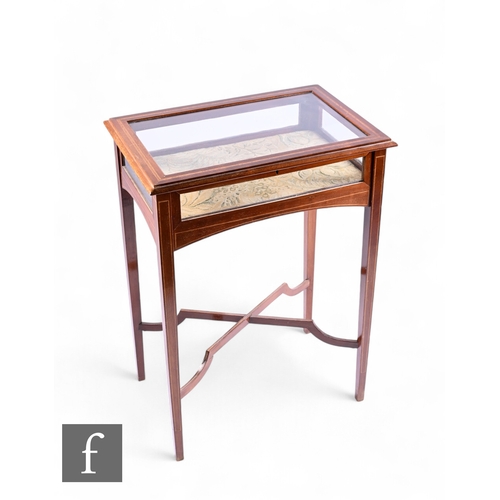 1044 - An Edwardian line inlaid mahogany bijouterie cabinet, glazed hinged top and sides on slender square ... 