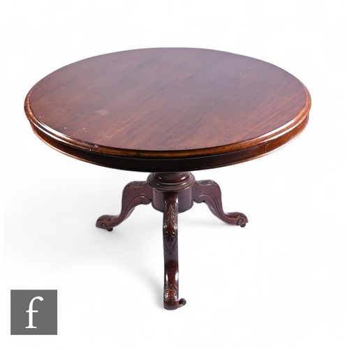 1063 - A Victorian circular mahogany pedestal breakfast table on turned pedestal and splayed tripod legs an... 