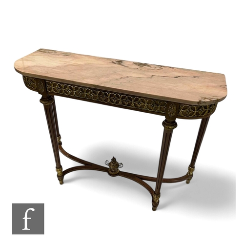 1082 - A 20th Century Louis XVI style pink marble top consul table, gilt mounted frieze, on fluted tapering... 