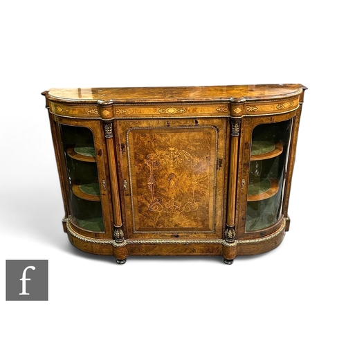 1085 - A 19th Century figured marquetry inlaid walnut credenza enclosed by an arched framed door flanked by... 