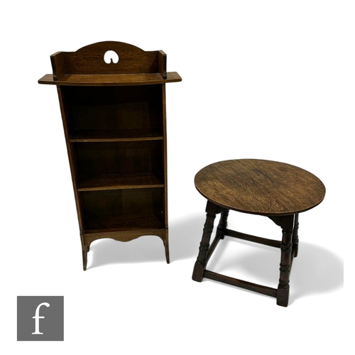 1089 - A small Arts & Crafts open floorstanding bookcase, height 108cm, and a circular oak occasional t... 