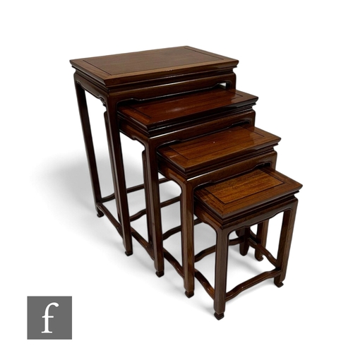 1096 - A 20th Century quartetto of Chinese hardwood occasional tables on shaped legs and stretchers, the la... 