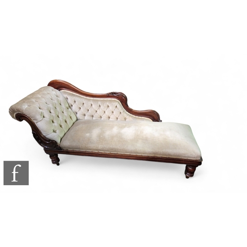 1054 - A Victorian mahogany framed single scroll back chaise longue on turned legs, upholstered in pale plu... 