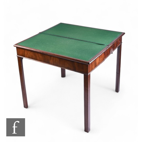 1067 - A George III rectangular fold over card table, the moulded edge top over a plain frieze on square bl... 