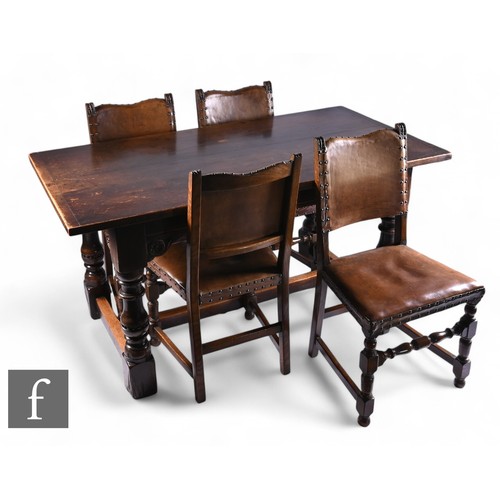 1101 - A 17th Century style oak refectory dining table, the cleated end top over a plain frieze and corner ... 