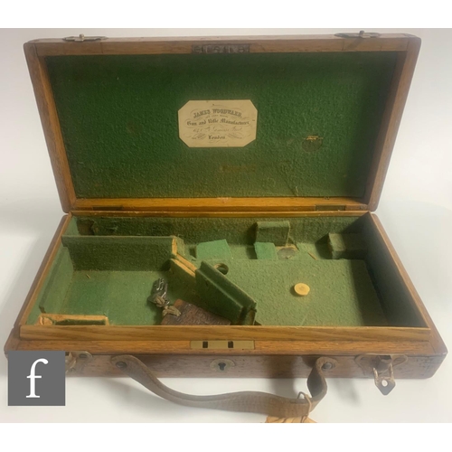 637 - A 19th Century oak pistol case with green felt divisioned interior, labelled James Woodward London, ... 