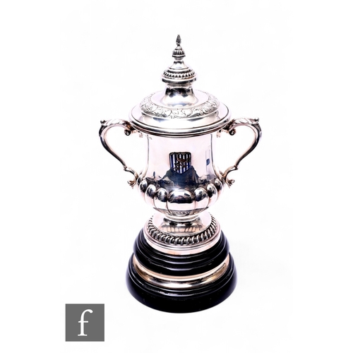 390 - A hallmarked silver West Bromwich Albion FA Cup Winners silver and enamel cup, an exact half size ex... 