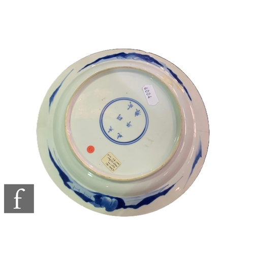 463 - A Chinese blue and white Kangxi period dish, of circular form, decorated with figures amongst formal... 