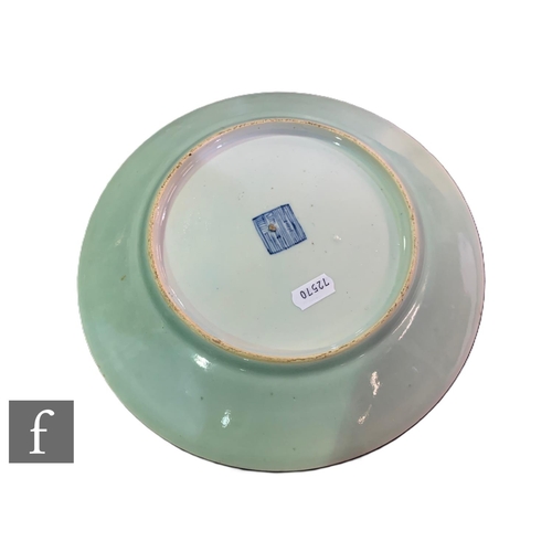 531 - A collection of 19th Century Chinese celadon ground famille rose dishes, all similarly decorated wit... 