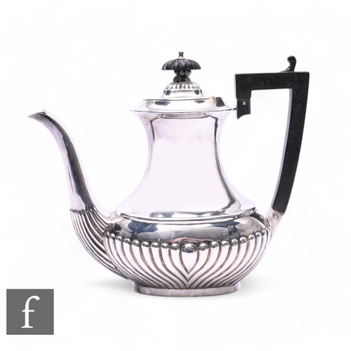 403 - A hallmarked George V silver coffee pot, Birmingham 1920, qadrooned lower quarter, stepped lid and s... 