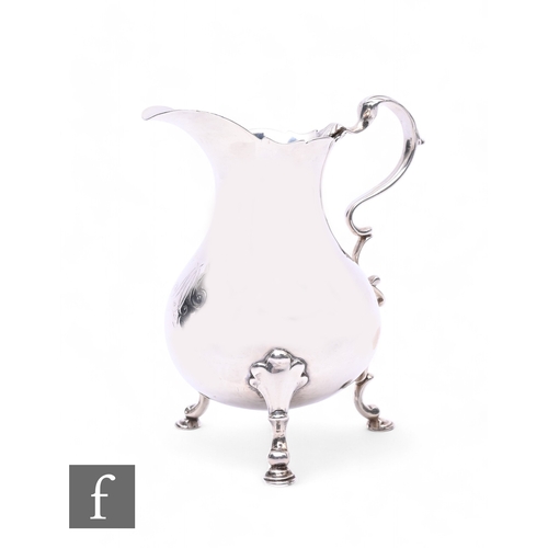 407 - A George II hallmarked silver cream jug, London 1745, maker's marks rubbed, 3.9ozt, height 11.25cm.