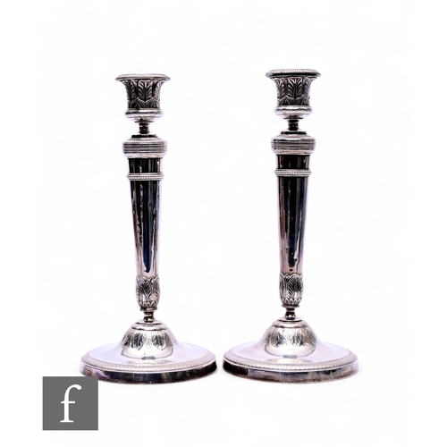 408 - A pair of French silver candlesticks, circa 1820, neo-classical style, tapered stem on circular foot... 