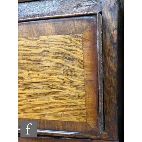 85 - A George III mahogany crossbanded oak kneehole dressing chest fitted with a single long drawer below... 