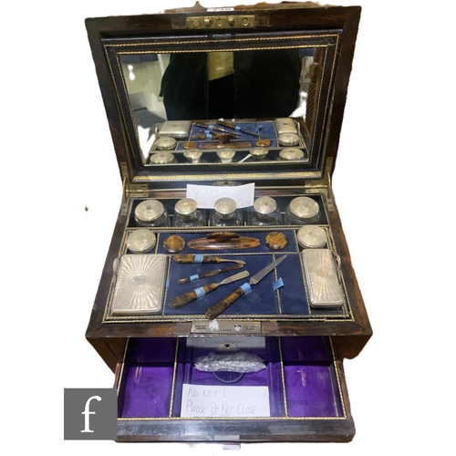 738 - A 19th Century coromandel and brass inlaid dressing table box, the lid opening to reveal a fitted in... 