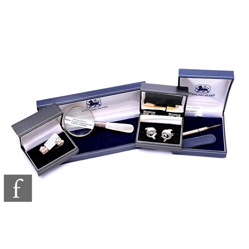 416 - A collection of sterling silver, including novelty cufflinks, an engine turned toothpick with gold m... 