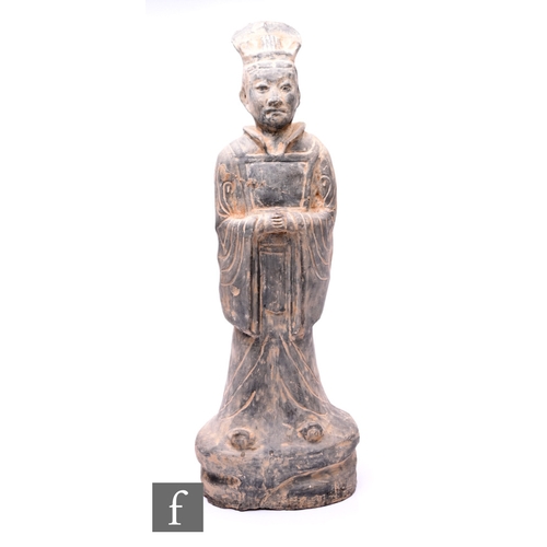 470 - A Chinese pottery funerary tomb figure (206 BC-AD 220) or later, modelled as a standing official dre... 