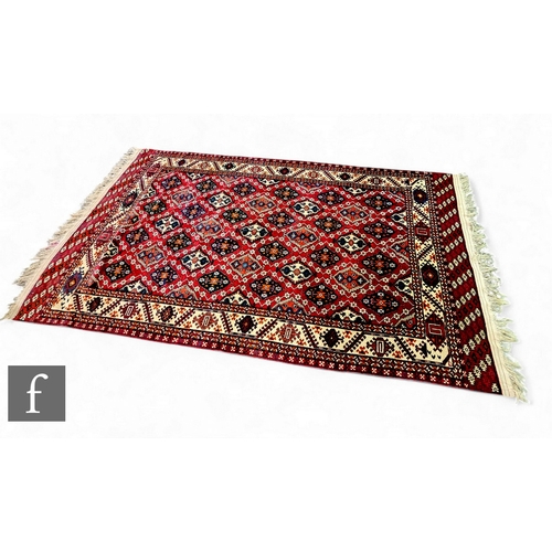 562 - A large Chodor carpet, probably early 20th Century, soft pile with Chodor gul design, with Yomud edg... 