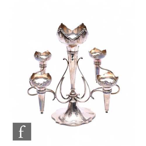 474 - A hallmarked silver five trumpet epergne, oval base with presentation engraving rising to four scrol... 