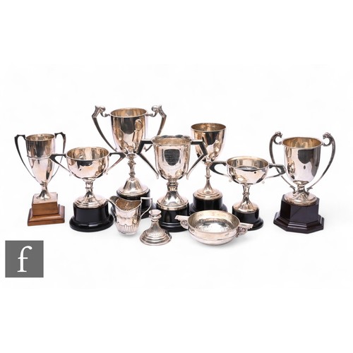 479 - Seven assorted hallmarked silver trophy cups to include engraved and plain examples, with a silver c... 