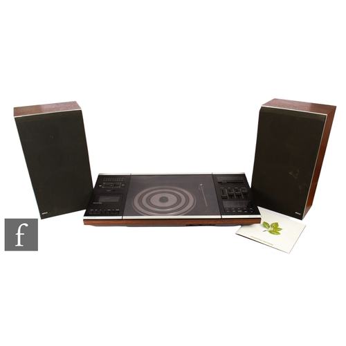 134 - A Bang & Olufsen Beocenter 2002 turntable with tape deck, together with a pair of Bang & Olu... 