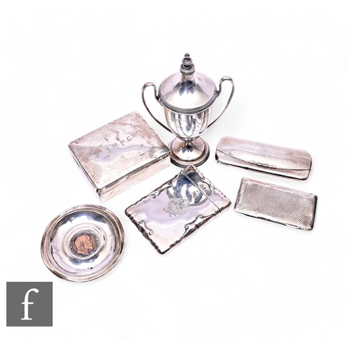 497 - A small parcel lot of assorted hallmarked silver items to include a small cup and cover, two card ca... 