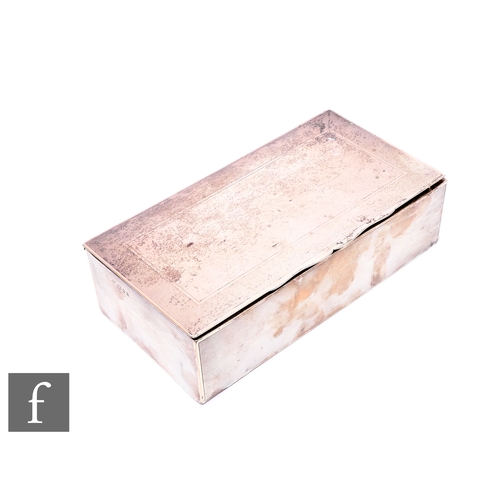 499 - A hallmarked silver rectangular cigarette box with engine turned decoration to whole, presentation e... 