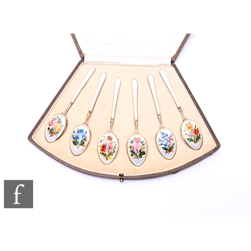 507 - A cased set of six 1930s silver and enamel coffee spoons, the reverse of each bowl detailed with flo... 