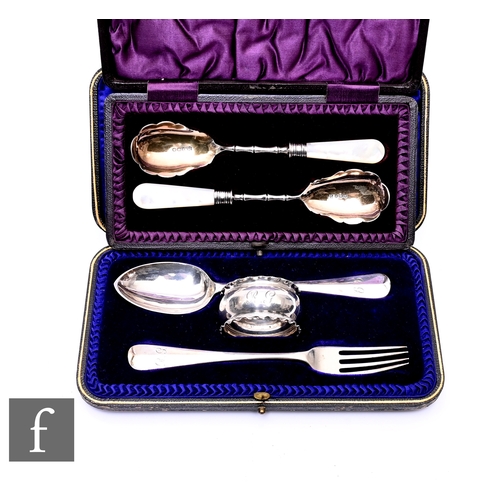 514 - An Edwardian cased pair of silver preserve spoons of bamboo design with mother of pearl handles, She... 