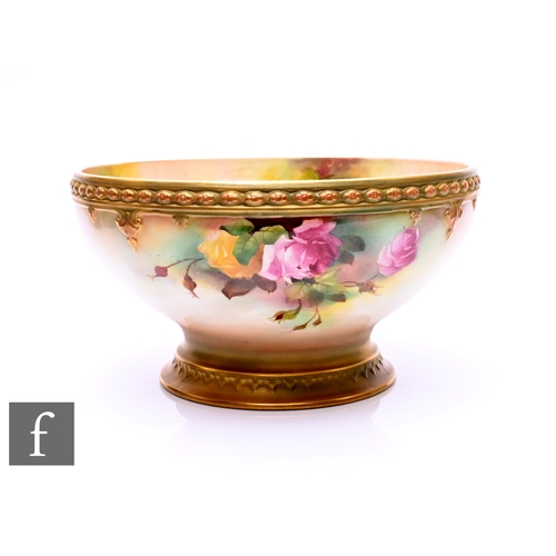 44 - A Royal Worcester rose painted pedestal bowl by William (Harry) Austin, circa 1906, of circular form... 