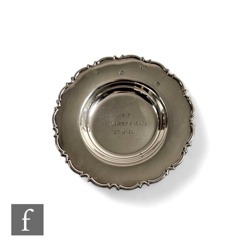 434 - A contemporary silver dish with scalloped rim, engraved to the central field A-B Sy St. James Palace... 